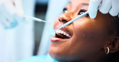 Smiling patient during a dental check-up at Summit Dental Care